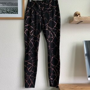 Black leggings with rose-gold detailing, medium